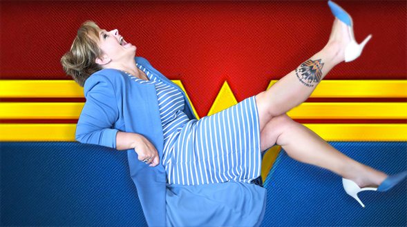 Angel laughing in a blue outfit with her feet playfully kicked up